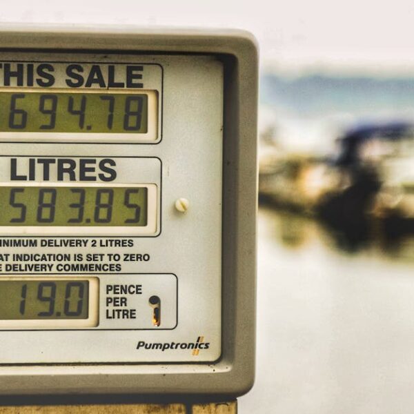 Selective focus photography of fuel station display showing energy costs