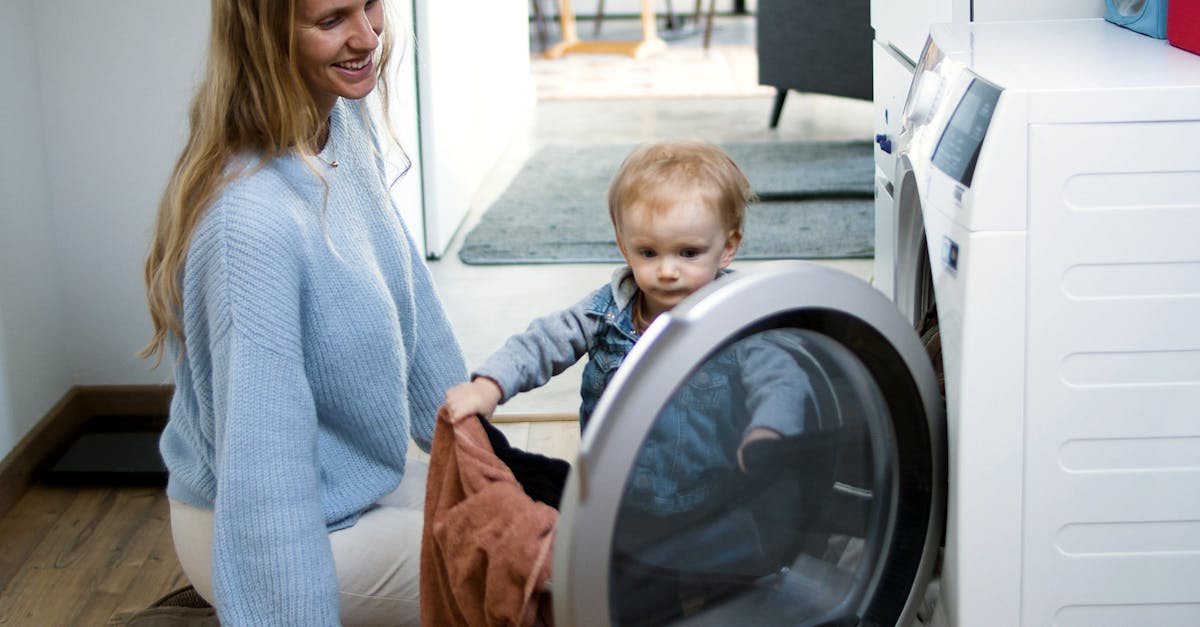 Mother and toddler joyfully doing laundry together, fostering family bonding at home