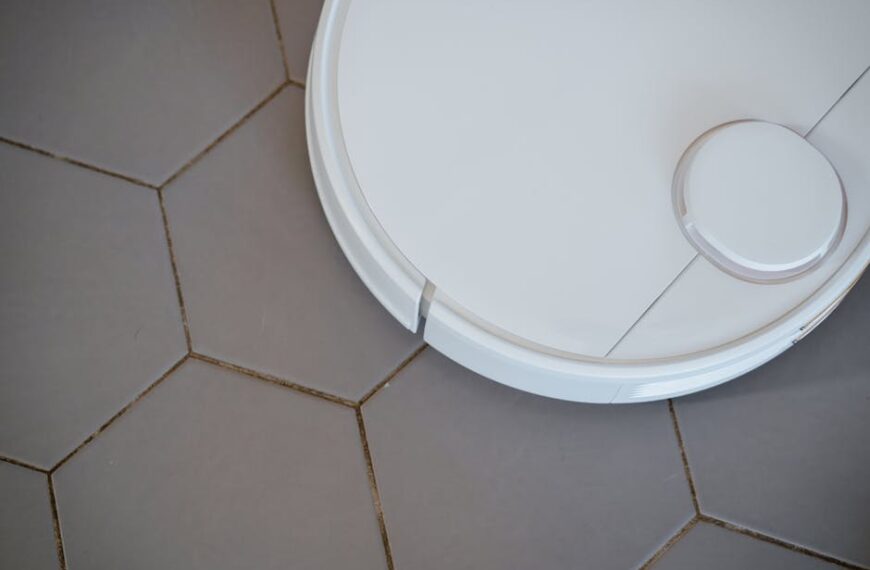Close-up of a robotic vacuum cleaner on hexagonal tiles for efficient cleaning
