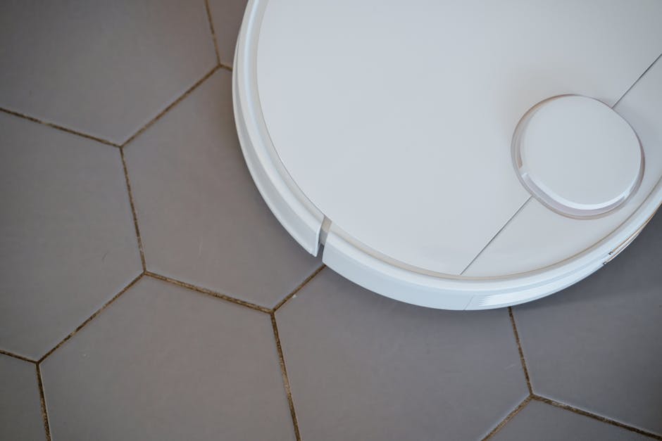 Close-up of a robotic vacuum cleaner on hexagonal tiles for efficient cleaning